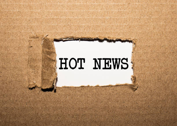 istock The text HOT NEWS. behind torn brown paper 1251987608