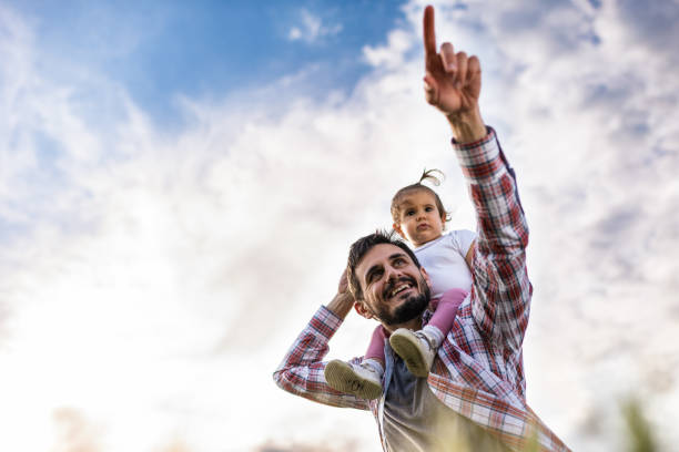 istock Father and daughter exploring nature together 1251991607