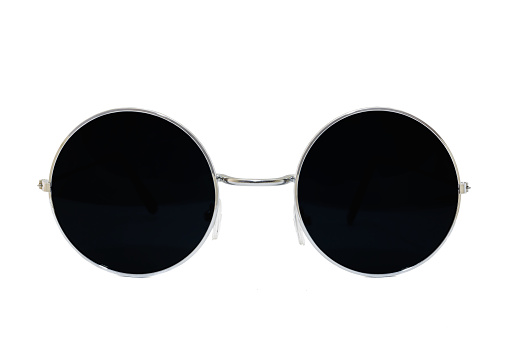 Street style oval sunglasses with thin silver metal frame, black matte lens, isolated on white background, side view.