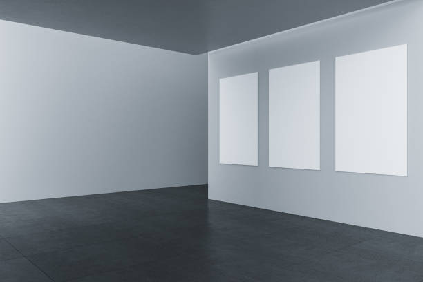 istock Contemporary gallery interior with three empty banners on wall. 1252007660