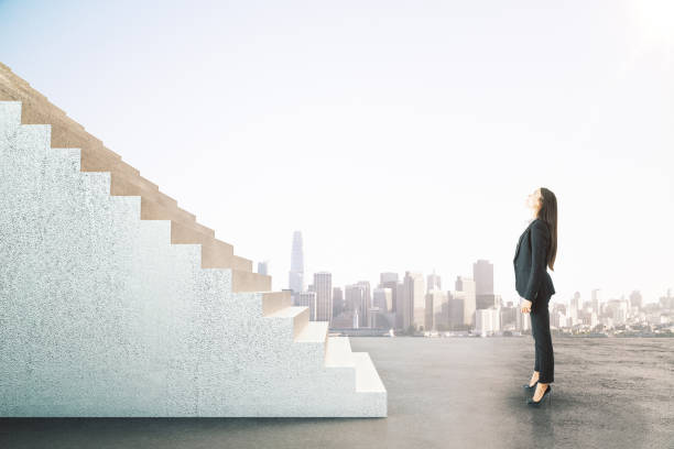 istock Young businesswoman looking on abstract stairs 1252007689