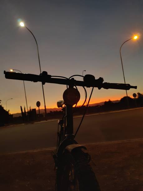 istock bike silhouette and sunset 1252015805