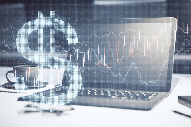 istock Laptop with dollar symbol and forex chart in office. 1252016089