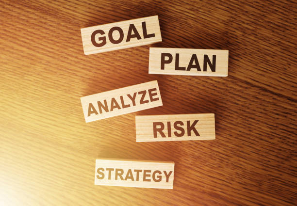 istock Wooden blocks with the words: goal, risk, strategy, plan, analyze on table. Business concept 1252018335