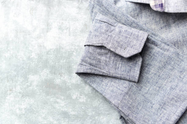 istock Men's linen shirt on bright wooden background. Top view. Copy space. 1252029068