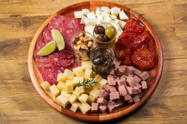 istock round board with various antipasti appetizers. 1252030791