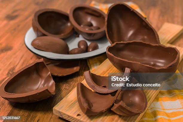 Chocolate Eggs On Wooden Background Stock Photo - Download Image Now - Easter Egg, Chocolate Easter Egg, Chocolate