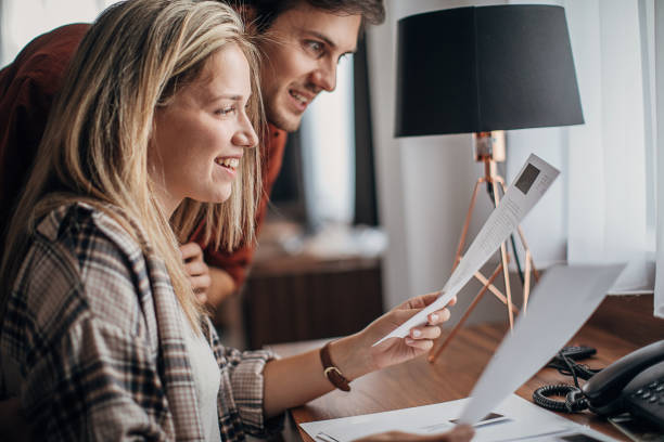 Couple looking at brochures in hotel room