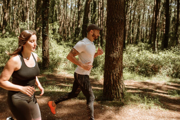 istock Young couple jogging 1252058591