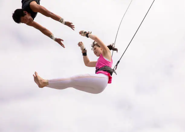 Young female athlete flying in the sky