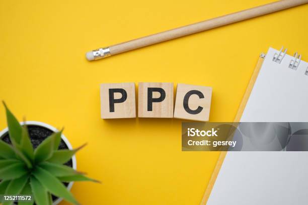 Modern Marketing Buzzword Ppc Pay Per Click Top View On Wooden Table With Blocks Top View Stock Photo - Download Image Now