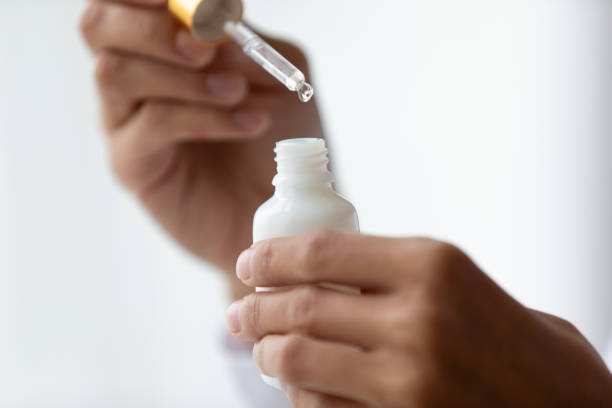 istock Woman use liquid serum for face moisturizing 1252120034