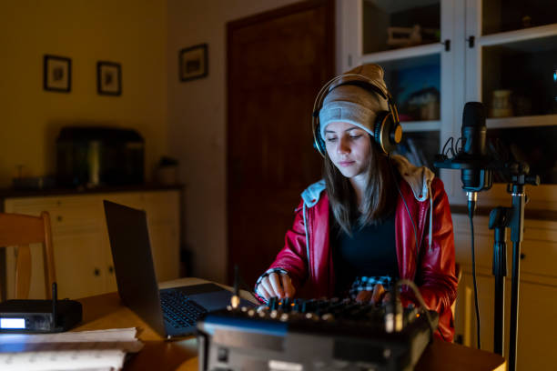 dj streaming from home at night - youth culture audio imagens e fotografias de stock