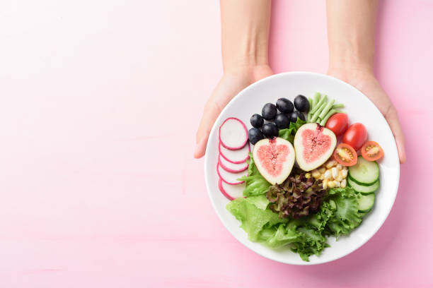 istock Fruits and vegetables salad, Vegan food 1252137797