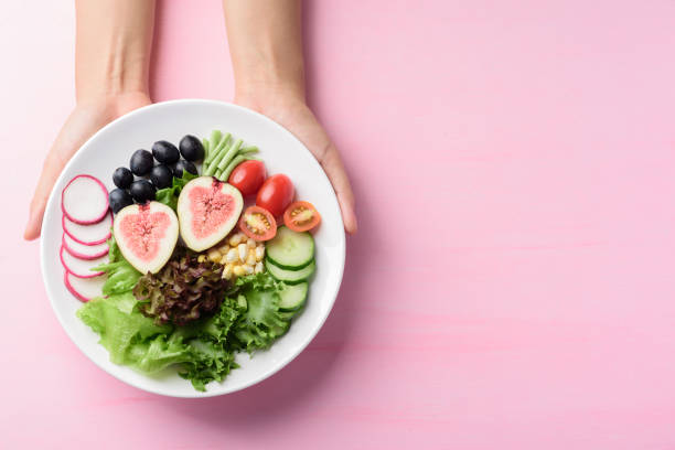 istock Fruits and vegetables salad, Vegan food 1252138829