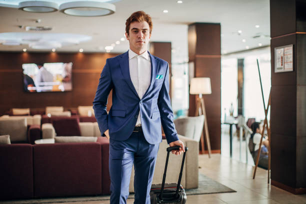 istock Modern man in blue suit arriving in hotel 1252154351