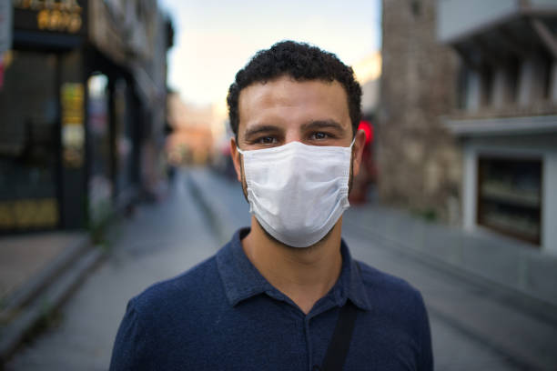 istock man in medical mask on his face looking to camera 1252166591