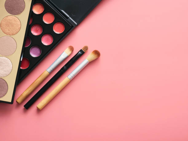 istock Makeup kit and cosmetic set on pink surface 1252171286