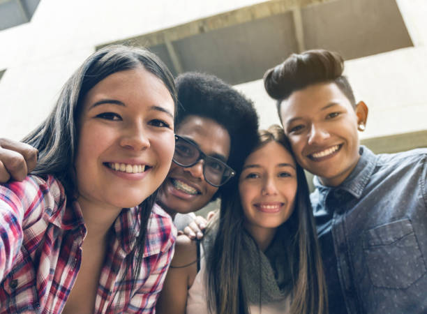 istock Cheerful group of friends taking a selfie smiling 1252179096