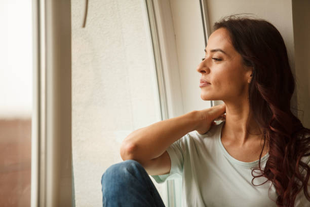 istock Looking through the window and reminiscing on old memories 1252192768
