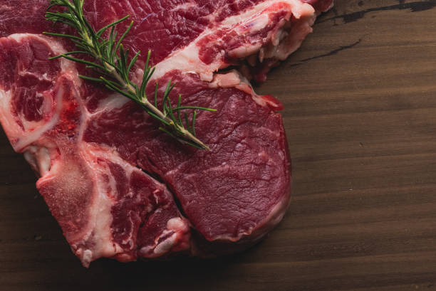 istock Top view raw Tibone with bone beef steak with ingredients for grilling with a spice rub 1252201661
