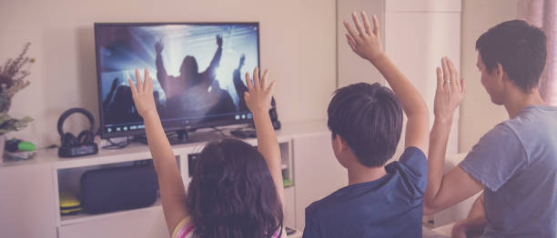 Children praying with father parent , family and kids worship online together at home, streaming church service, social distancing concept Children praying with father parent , family and kids worship online together at home, streaming church service, social distancing concept religious text stock pictures, royalty-free photos & images