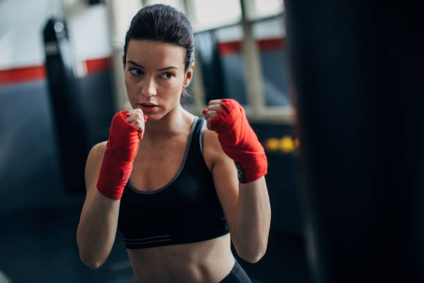 istock Female boxer training alone in gym 1252206025