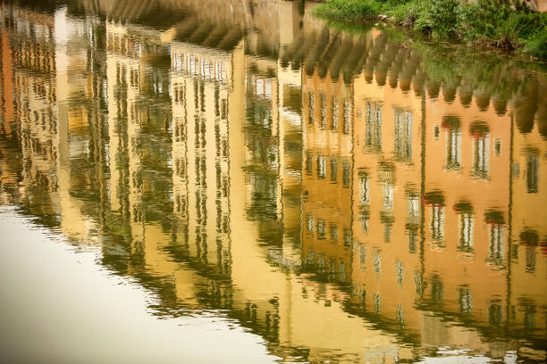 istock Reflections of buildings along the Arno river 1252216236