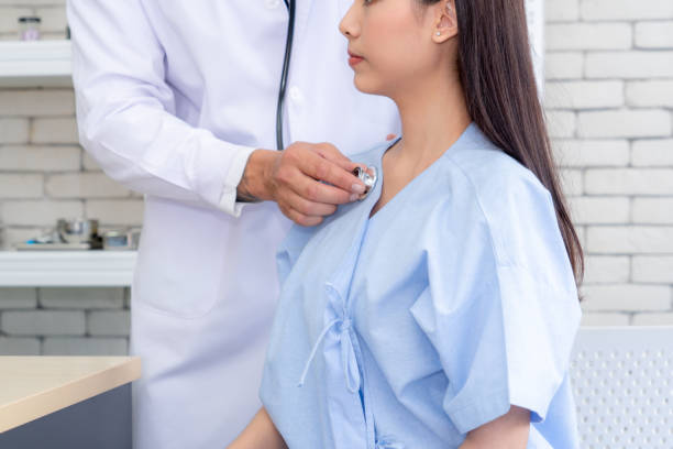 istock Doctor in professional uniform examining patient at hospital 1252247809