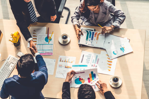 istock Group business people handshake at meeting table 1252250500