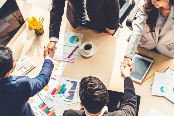 istock Group business people handshake at meeting table 1252250525