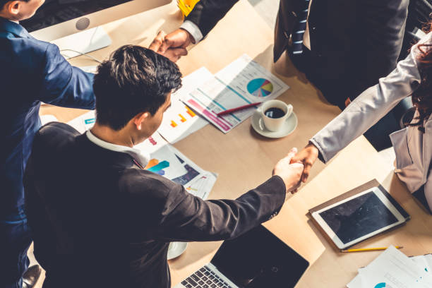 istock Group business people handshake at meeting table 1252250534