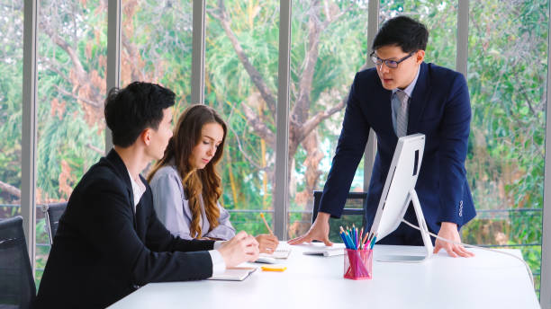 istock Angry business person dispute work problem in group meeting 1252250704