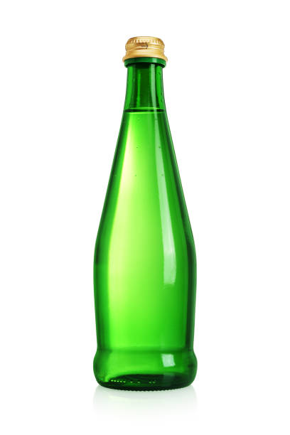 istock Green glass bottle with water without label isolated on white. 1252258554
