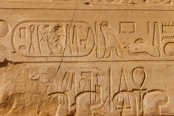 istock Ancient egyptian hieroglyphs on the wall in Karnak Temple Complex in Luxor, Egypt 1252259639