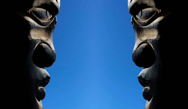 Confrontation concept. Two wooden human faces look at each other aggressively.