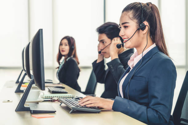 Business people wearing headset working in office