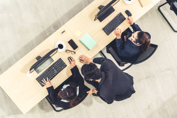 istock Business people wearing headset shot from top view 1252264366
