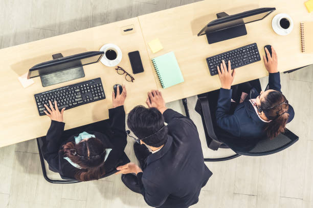 istock Business people wearing headset shot from top view 1252264376