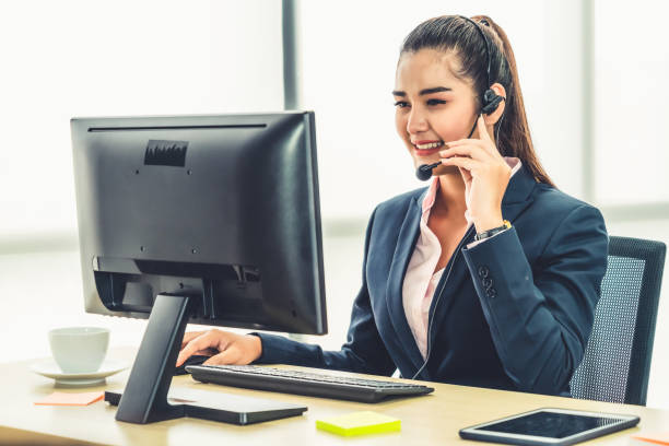 istock Business people wearing headset working in office 1252264412