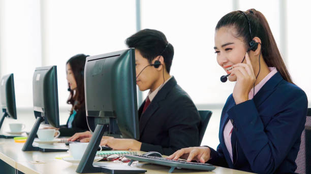 Business people wearing headset working in office