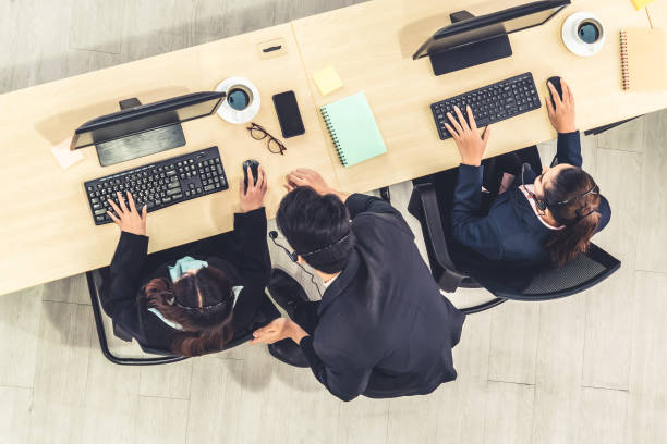 Business people wearing headset shot from top view