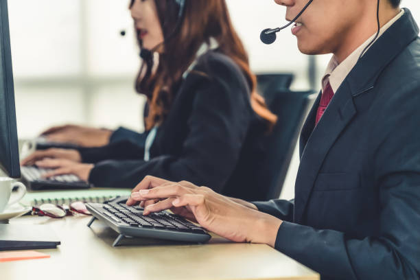 Business people wearing headset working in office