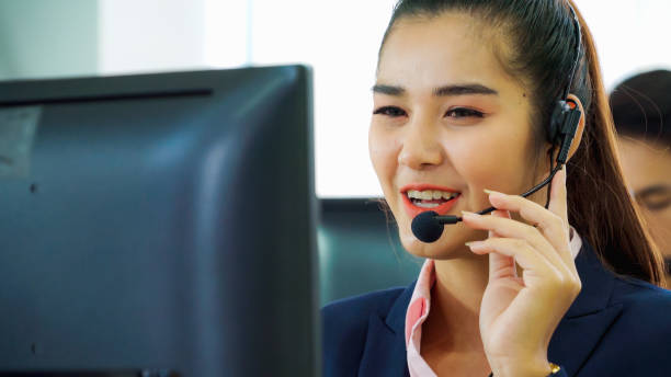 istock Business people wearing headset working in office 1252264498
