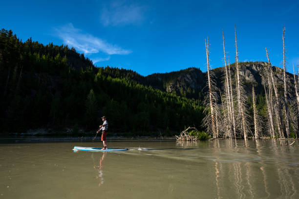 istock Paddleboard adventure in the mountains 1252264913