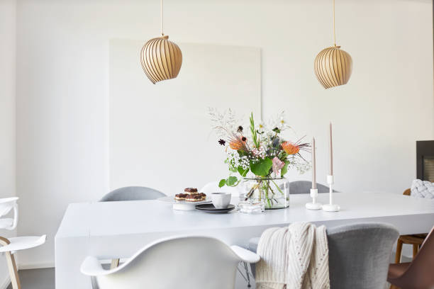 istock Different photos of a decorated white dining table in a bright environment with flowers and a flower vase 1252270125