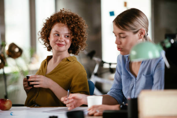 istock Businesswomen working on project and drinking coffee. 1252271242