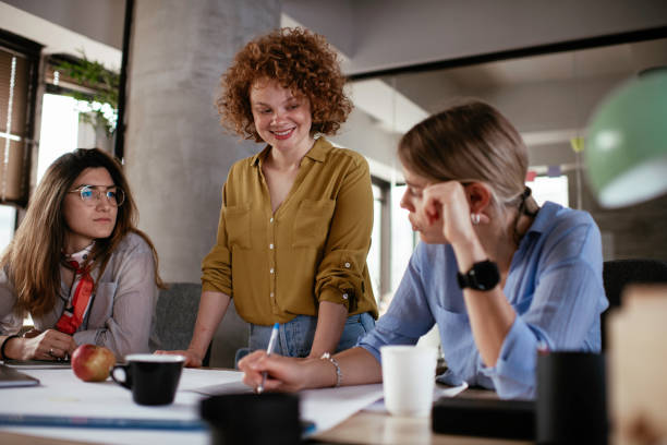 istock Businesswomen working on project and drinking coffee. 1252271283