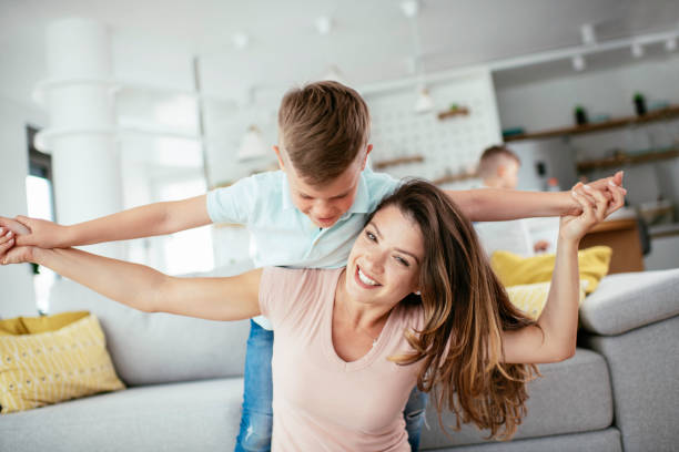 istock Mom and son having fun at home 1252271401