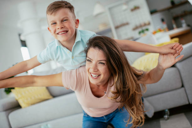 istock Mom and son having fun at home 1252271404